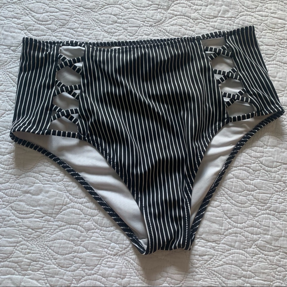 Shade and Shore Swimsuit bottoms hight rise with front sides peep opening.